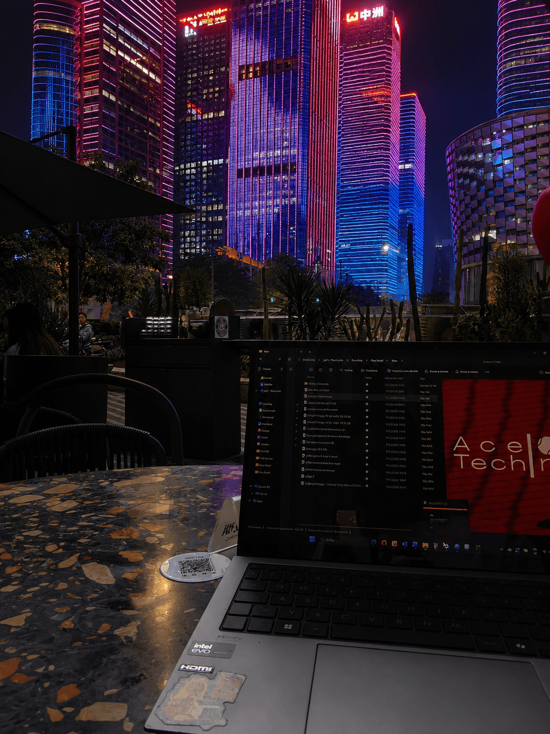 Working late in Shenzhen with the city skyline lit up outside