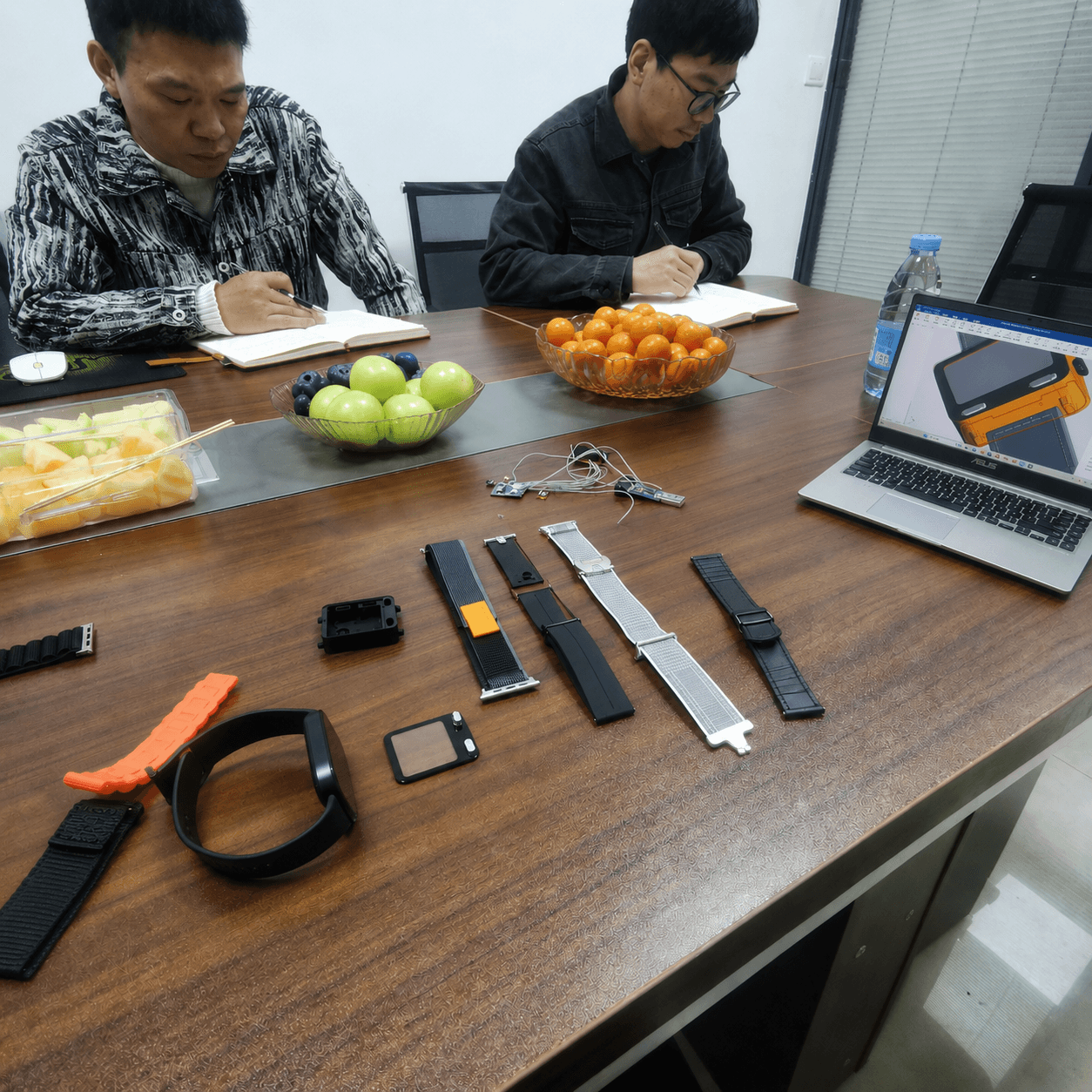 Reviewing early AceBand strap and case prototypes with the manufacturing team